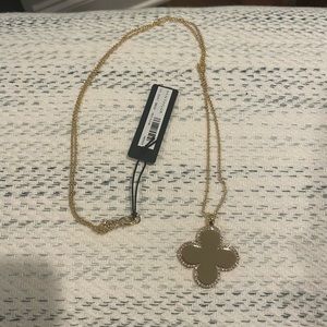 NWT - Ann Taylor Gold Clover Necklace. crystal outline on one side.